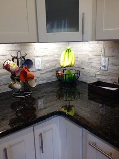 a kitchen counter with some bananas on it