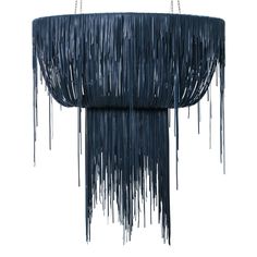 a black chandelier with fringes hanging from it's sides, on a white background