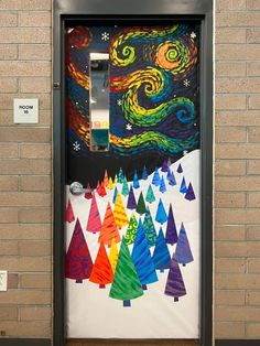 a door decorated with christmas trees and the night sky painted on it's side