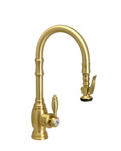 an antique brass faucet with two handles