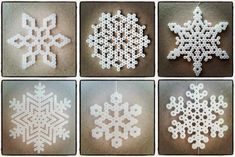 six snowflakes are shown in four different styles and sizes, each with an ornament shaped like a snowflake