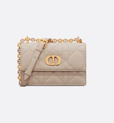 The Miss Caro mini bag enhances the Dior Caro line with modern and timeless elegance. Crafted in powder beige lambskin, it stands out with the unique quilted effect of Macrocannage stitching, as well as a flap accented by a gold-finish metal CD twist clasp inspired by the seal of a Christian Dior perfume bottle. Alternating between gold-finish metal links and tonal enamel links that match the leather, the adjustable chain shoulder strap has a leather insert for added comfort when carrying the ba Dior Perfume Bottle, Dior Caro, Christian Dior Perfume, Dior Star, Christian Dior Couture, Dior Couture, Wallet Pouch, Backpack Tote Bag, Miss Dior