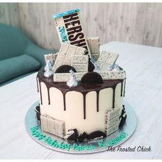 a birthday cake decorated with newspaper and chocolate icing