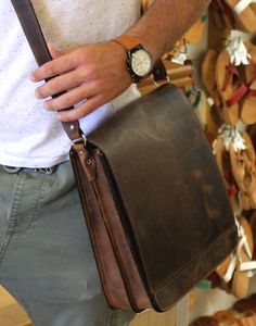 "Beautifully handcrafted casually elegant men's leather bag, made of a high quality leather. Briefcase, suitable for businessmen and students. Perfect fit for A4 papers, IPad and Tablet and all of your essentials! This bag is the perfect way to stay organized on the go. Our sturdy, structured and simply designed messenger bag is right on trend, with its clean lines and un-fussy style, is the ideal accessory to complete any casual outfit. You can wear it as a shoulder bag or a crossbody bag. ► Th Classic Bags With Leather Strap For Everyday Carry, Leather Briefcase With Soft Leather As Gift, Oiled Leather Rectangular Satchel For Daily Use, Leather Briefcase Perfect For A Gift, Rectangular Everyday Bag With Leather Strap, Soft Leather Briefcase As Gift, Leather Bag With Leather Strap For Everyday Carry, Rectangular Bag With Leather Strap For Everyday Carry, Rectangular Oiled Leather Satchel For Daily Use