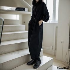 Olivia Mark - Black Loose-Fitting Jumpsuit with Cotton Workwear Black Long Sleeve Jumpsuits And Rompers For Fall, Black Jumpsuits And Rompers With Pockets For Fall, Black Relaxed Fit Jumpsuit For Workwear, Black Long Sleeve Cotton Jumpsuits And Rompers, Black Long Sleeve Jumpsuits For Work, Black Long Sleeve Jumpsuits And Rompers For Work, Black Cotton Jumpsuits And Rompers For Fall, Cotton Jumpsuits And Rompers For Winter Workwear, Winter Cotton Jumpsuits And Rompers For Work