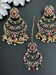 This Set comes with Maangtikka and matching earrings and in 3 beautiful pastel colors. Extremely high quality stones and handwork for a beautiful elegant look. This lightweight and elegant Maangtikka set is perfect for any bridesmaid, bride, sangeet or any occasion or event as a gift for any occasion as any one who loves jewelry will love this statement piece. It has beautiful colors that really make the set a statement piece. Product Details: • Tikka/Headpiece • Earrings Free Shipping/Ready to Elegant Multicolor Bridal Sets With Stone Work, Elegant Multicolor Hand Set Chandbalis, Elegant Multicolor Chandbali Tikka, Festive Rose Gold Chandbali Jewelry, Elegant Multicolor Tikka For Festive Occasions, Elegant Multicolor Tikka For Wedding, Elegant Wedding Tikka With Matching Earrings, Multicolor Hand Set Chandbalis For Wedding, Elegant Multicolor Kundan Tikka