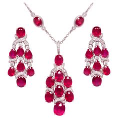 The ruby and diamond necklace and earrings chandelier set is constituted by faceted heated rubies of homogeneously brilliant quality, especially cut from larger Mozambique rough to obtain the sizes as necessary for the design. The total weight of rubies after cutting is approximately 120 carats. The total weight of diamonds is 6.12 carats. All of our diamonds are of top quality (color, clarity and cut F-VVS). The set is one-of-a-kind not only for the difficult matching/cutting of the stones, but Diamond Necklace And Earrings Set, Chandelier Set, Diamond Necklace And Earrings, Ruby Diamond Necklace, Chain Ideas, Sapphire Diamond Necklace, Jewel Design, Ruby And Diamond Necklace, Drop Necklaces