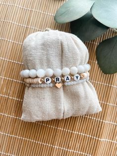 Custom neutral bracelet stack This bracelet stack is super cute and trendy. You are able to choose the word that you want and make it personal. Such a cute expression of faith. Please choose the color for the word bracelet. If you need a size other than 7 please leave that in the box too. The average size for a female is 7 inches. To measure your wrist: *Take a piece of yarn and measure around your wrist with the yarn and then measure the yarn in inches to get your wrist measurement. These are d Bachelorette Beaded Bracelets, Inspirational Handmade Bracelets For Everyday, Inspirational Handmade Bracelet For Everyday, Inspirational Handmade Name Bracelet For Everyday, Everyday Inspirational Handmade Name Bracelet, Inspirational Handmade Name Bracelet, Everyday Inspirational Bracelets With Letter Beads, Everyday Inspirational Bracelet With Letter Beads, Inspirational Everyday Bracelets With Letter Beads