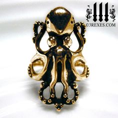 The Enchanted Octopus ring has 8 whimsical legs that are sprinkled with silver studs. Have fun flashing your statement ring, designed to be lightweight and fanciful! About 1. 25" tall Antiqued Bronze (see below for info & care) Color and shade will vary from the photos, no two are alike! 3 Rexes box included (may vary) PATINA CARE: Please avoid harsh chemicals, soaps, sweating, hot water, etc., as this may remove the patina. ATTN Please Read Disclosure: 1. Antiquing may vary 2. The bronze patina may slowly change over time. 3. Please make sure you are fine with bronze before purchasing. Bronze is alloyed with copper so it can cause skin discoloration in a certain percentage of the population. As with any metal (ex. brass, silver and gold), discoloration can be caused by the pH level in you Octopus Ring, Jewelry Ocean, Sea Jewelry, Bronze Patina, Skin Discoloration, Steampunk Jewelry, Fishing Gifts, Dream Ring, Animal Jewelry