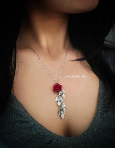 Beautiful red resin rose with dangling silver leaves. Detailed stainless steel leaves measure 15.5mm x 11mm. Total pendant length with rose and leaves is just over 2 inches. This necklace is 18'' long with lobster clasp. *15mm Resin rose *Stainless steel chain *Stainless steel leaves *Handmade with love <3 Like Jmesjewelrybox on Facebook for updates on new jewelry, upcoming sales and giveaways! Plus Facebook fans save 5% :D Find the coupon code on Jmesjewelrybox's cover photo https://www.face Rose Colored Dangle Jewelry With Rose Design, Valentine's Day Dangle Jewelry With Rose Design, Red Flower Pendant Jewelry With Rose Design, Rose Dangle Jewelry For Gift, Red Rose Design Flower Pendant Jewelry, Luxury Red Rose Design Flower Pendant Jewelry, Red Dangle Jewelry With Rose Design, Red Rose Design Dangle Jewelry, Rose Branch