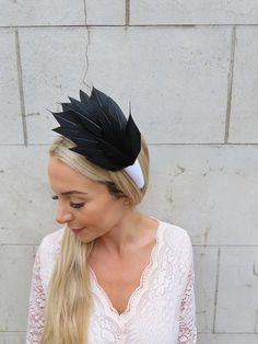 Beautiful feather headpiece This is perfect for adding style to your hair. Featuring feathers and padded headband.  The headband base measures 4.5cm wide at it's widest point. Available in other colours in our shop. Made in the UK - Black Feathered Headband Fascinator, Adjustable Feather Headband, Adjustable Feather Headband For Kentucky Derby, Adjustable Feather Trim Headband, Feathered Adjustable Headband For Kentucky Derby, Feather Trim Headband Fascinator For Races, Fitted Feather Headband, Formal Feather Trim Headband Fascinator, Formal Headband Fascinator With Feather Trim