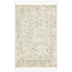 a white rug with an intricate design on the top and bottom, in grey tones