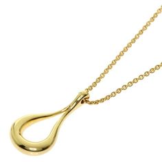 TIFFANY & Co. 18K Gold Elsa Peretti Open Teardrop Pendant Necklace Metal: 18K Yellow Gold Chain: 16" long Pendant: 17.5mm long x 7.5mm wide  Hallmark: TIFFANY&CO. 750 PERETTI SPAIN" on chain tags Condition: Excellent condition  Authenticity guaranteed Formal Hallmarked Teardrop Necklace, Gold Drop Necklaces For Formal Occasions, Classic Drop Necklace In Yellow Gold, Luxury Pear-shaped Yellow Gold Drop Necklace, Formal Gold Drop Necklace, Long Drop Yellow Gold Necklace For Formal Occasions, Formal Yellow Gold Drop Necklace, Formal Gold Teardrop Drop Necklace, Formal Teardrop Yellow Gold Necklace