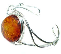 Handmade Unique 925 Sterling Silver bracelet with unique one of a kind Amber,  23.80 grams of marvelous handcrafted jewelry design. Only one piece availble ready to ship! It's unique worldwide bracelet - simply piece of art in world of fine jewelry. Vintage Design  Genuine Polish Amber .925 Sterling Silver handamde Bracelet / Cuff  BRACELET DETAILS: Weight: 23.80g; Material: Sterling Silver; Main stone: Amber; Width (widest section): L- 1 1/2, W - 1 1/8, T- 3/8 inch; Inner circumference: 6-9 inc Unique Cabochon Cuff Bangle Bracelet, Unique Cabochon Bangle Bracelets, Handmade Fusion Style Sterling Silver Cuff Bracelet, Handmade Sterling Silver Fusion Cuff Bracelet, Adjustable Cabochon Sterling Silver Cuff Bracelet, Adjustable Sterling Silver Cuff Bracelet With Cabochon, Adjustable Sterling Silver Cabochon Cuff Bracelet, Unique Nickel-free Round Cuff Bracelet, Handmade Oval Sterling Silver Bangle