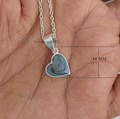 customized dainty heart shape pendant necklace for memorial , proposal ,wedding , anniversary etc. While beauty may be in the eye of the beholder, quality should never be a compromise. I strive to produce only the highest quality products for my customers. product description : *metal  : 925 sterling silver *stamp : 925 * pendant height : 14 mm with loop * pendant width : 12 mm * depth : 3 mm * weight : 2 gram  * heart size : 12x12 mm * BLACK METALLIC POWDER MIXED WITH RESIN AND POUR INSIDE THE Metallic Powder, Loop Pendant, Heart Shaped Pendant Necklace, Urn Necklace, Necklace For Her, Urn Necklaces, Black Resin, Proposal Gifts, Keepsake Jewelry