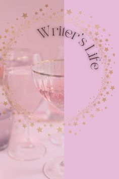 two wine glasses sitting next to each other on top of a pink table with gold stars