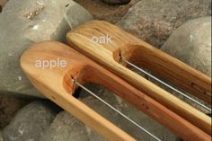 an image of a wooden bow laying on some rocks with the caption oak and apple