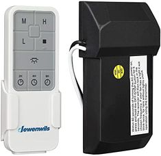 a remote control next to a black and white box