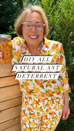 an older woman with glasses holding a jar of honey in front of her face and the words diy all natural ant deterent on it