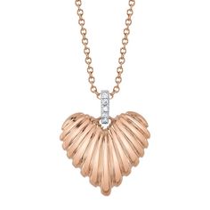 Introducing a symphony of elegance: our 0.02ct Round Brilliant Cut Diamond Fluted Heart Necklace, meticulously fashioned in modern 14k Rose Gold. Setting itself apart with its distinct design, this necklace boasts diamonds adorning the bail, while the heart flaunts a captivating convex silhouette, adding depth and allure to the design. Elevate your style with this exceptional necklace, a testament to love and individuality. Rose Gold Heart Pendant Diamond Necklace, Rose Gold Diamond Heart Pendant Necklace, Elegant Rose Gold Diamond Cut Heart Necklace, Elegant Rose Gold Heart Necklace With Diamond Cut, Rose Gold Heart Cut Diamond Necklace With Accents, Rose Gold Heart-shaped Diamond Necklace, Rose Gold Heart Necklace With Diamond Accents, Mark Broumand, Love Necklace