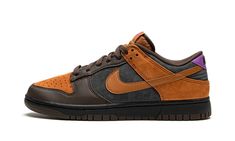 The Nike Dunk Low “Cider” is a fall-ready colorway of the low-top sneaker that features both suede and leather on its design.  The “Cider,” an August 2021 release, arrived in an autumn color palette highlighted by its Dark Chocolate-colored leather overlays on the toe cap, forefoot, and eyelets, and Cider suede panels on the perforated toe, collar, and heel.  The Swoosh appears in Cider-colored leather on the sides.  Classic “Nike” branding is embroidered on the purple leather heel overlay.  Off Noir suede comprises the base.  Chocolate brown laces are layered over the Cider nylon tongue.  Purple “Nike” and Swoosh detailing is found on the tongue tag.  The look is rounded into form with a black rubber midsole and brown outsole.  Release date: August 11, 2021 Nike X Travis Scott, Nike Branding, Low Air Jordan 1, Purple Nikes, Dunks Nike, Nike Dunk High, Nike Brand, Nike Shox, Air Jordan 3