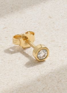 Simple yet elegant, Kimaï's single earring is the perfect addition to any stack. It's cast in a circular shape from polished 18-karat recycled gold and bezel-set with a laboratory-grown round-cut diamond that's 0.25-carats. Timeless Gold Earrings With Bezel Setting, Gold Earrings With Bezel Setting In Timeless Style, Gold Earrings With Bezel Setting Timeless Style, Everyday Yellow Gold Earrings With Single Diamond, Dainty Recycled Gold Earrings, Round Recycled Gold Earrings As Gift, 14k Yellow Gold Earrings With Bezel Setting, Yellow Gold 14k Bezel Set Earrings, Fine Jewelry Round Earrings In Recycled Gold