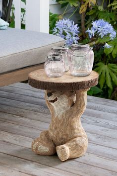 a wooden table with jars on top of it