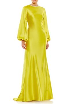 A bedazzled jewel neck stands out against falling folds of satin on a balloon-sleeve sheath gown that's gloriously gasp-worthy. 63" length Jewel neck Long sleeves Lined 100% polyester Spot clean Imported Chartreuse Evening Dress, Glamorous Dress, Satin Evening Gown, Evening Gowns With Sleeves, Evening Dress Collection, Sheath Gown, Mac Duggal Dresses, Trumpet Gown, Column Gown