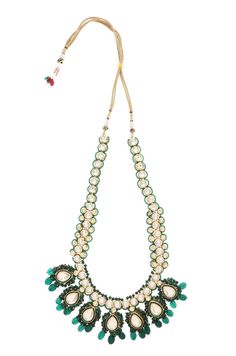 Gold plated uncut kundan polki necklace with earrings embellished with emerald green stones. Necklace Size - 26 inches. Closure - Adjustable dori Earrings - 4.5 cm Style Tip - We love teaming this with classy chiffon sarees or zari silk sarees. Looks best when worn with your royal whites, off whites and gold. We recommend styling with pastel solids or floral dresses in peachy pink, pistachio green and pastel blue too. Also, a great match for red lehengas or gold lehengas. We are suckers for red Festive Green Kundan Necklace, Festive Green Kundan Necklace With Zari Work, Festive Green Kundan Necklace With Gota Work, Green Kundan Necklace With Cutdana For Diwali, Green Kundan Cutdana Necklace For Diwali, Festival Green Kundan Necklace With Zari Work, Green Kundan Necklace With Zari Work, Green Bollywood Kundan Necklace With Zari Work, Green Kundan Necklace With Zari Work For Festivals