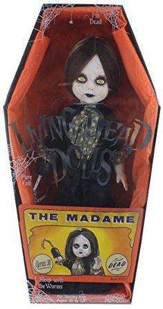 the doll is in an orange box with black and white writing on it's face