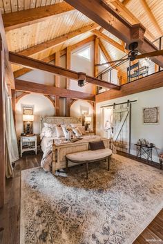 a large bed sitting inside of a bedroom on top of a wooden floor