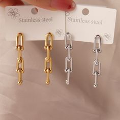 🐷B O L D ∙ C H A I N ∙ S T A I N L E S S ∙ S T E E L ∙ E A R R I N G🐷 Introducing our Punk Stainless Steel Earring in a captivating Gold Color! These earrings are designed to make a bold fashion statement and add a touch of edginess to any outfit. Crafted with high-quality stainless steel, these earrings are not only durable but also exude a rebellious charm. The thick chain design creates a striking visual impact, instantly elevating your style and showcasing your unique personality. * Materi Earring Fashion, Earring Gold, Chain Design, Wedding Jewelry Earrings, Drop Earring, Stainless Steel Earrings, Chain Earrings, Elegant Jewelry, Bold Fashion