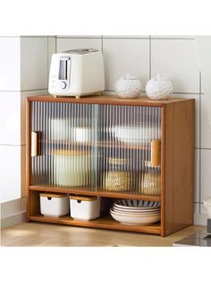 a microwave sitting on top of a wooden shelf