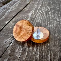 an open wooden container sitting on top of a wooden table