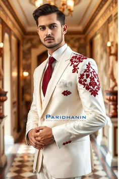 =>UNIQUE CREATION - PLEASE RESPECT COPYRIGHT<= All images and content on this site are exclusively crafted and owned by Paridhanin. Unauthorized copying, sharing, or reproduction is prohibited and will be subject to legal action. Stand out in this ivory suit with striking red embroidery on the shoulder and pocket. Crafted from high-quality fabric, this suit is perfect for grooms seeking a blend of tradition and modernity. The intricate embroidery adds a touch of elegance, making it ideal for weddings and special occasions. The price includes Jacket, pant and vest only. Other accessories if you want like shirt , tie and pocket square will be available on extra cost. For this message us in personalisation box. The suit is meticulously crafted from a luxurious  polyester blended fabric, ensur Elegant Red Unstitched Wedding Suit, Red Naqshi Unstitched Suit For Wedding, Red Unstitched Suit With Dabka For Formal Occasions, Wedding Fitted Set With Naqshi, Wedding Set With Naqshi Details, Fitted, Wedding Set With Naqshi, Fitted, Red Formal Sets With Dabka Detailing, Formal Red Sets With Dabka Detailing, Formal Red Dabka Sets