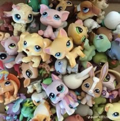 there are many little pony toys in the box together, all different colors and sizes