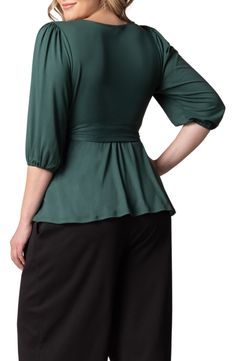 Add a graceful drape with a wrap top cut from a lightweight fabric for a look that's a breeze to style up or down. 26" length True wrap style with side tie closure Surplice V-neck Elbow-length sleeves 96% polyester, 4% spandex Machine wash, dry flat Made in the USA of imported fabric Chic Tops With Tie Waist And Surplice Neckline, Versatile Wrap Top With Tie Waist, Fitted Solid Color Wrap Top, Elegant Wrap Top In Solid Color, Chic Stretch Wrap Top With Surplice Neckline, Chic Wrap Top With Tie Back, Versatile Fitted Wrap Top, Elegant Wrap Top, Chic Fitted Wrap Top With Surplice Neckline