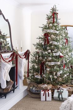 a decorated christmas tree with stockings on it