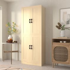 a living room with a large wooden cabinet and side table next to a doorway that leads to another room