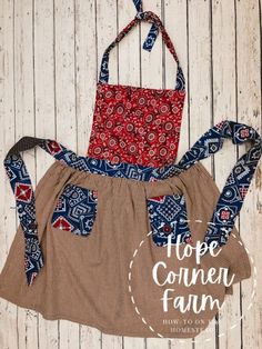 two aprons on top of each other with the words hope corner farm