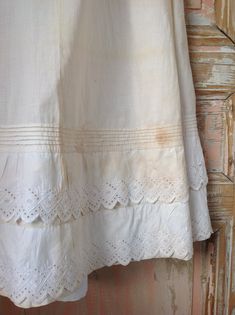 "strong antique cotton petticoat, hand made waist 66 cm 26\" length 102 cm and 104 cm at the back: 40\" and 41\" this skirt is unbleached that's way it is so very strong and wearable. It has discolorations, but They might go out when washing this skirt. button closure, pin tucks and hand embroidery work." Beige Cotton Skirt With Lace Trim, White Cotton Cottagecore Skirt, Cottagecore White Cotton Skirt, Cotton Skirt With Lace Trim For Daywear, Vintage Cotton Petticoat For Daywear, Victorian Cotton Petticoat For Daywear, White Cotton Skirt With Broderie Anglaise, White Broderie Anglaise Cotton Skirt, Cotton Long Skirt For Wedding