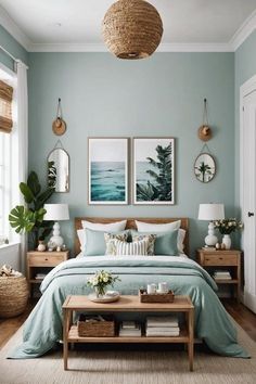 a bed room with a neatly made bed and two pictures on the wall above it