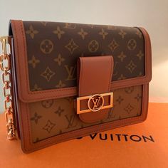 New Never Used Louis Vuitton Bag Authentic New Collection Travel Bag With Chain Strap And Monogram Canvas, Travel Shoulder Bag With Chain Strap And Monogram Canvas, Monogram Canvas Shoulder Bag With Chain Strap For Travel, Rectangular Monogram Canvas Shoulder Bag With Chain Strap, Designer Shoulder Bag With Chain For Travel, Designer Chain Shoulder Bag For Travel, Brown Monogram Canvas Shoulder Bag With Chain Strap, Gold Monogram Canvas Shoulder Bag With Chain Strap, Brown Monogram Canvas Bag With Chain Strap