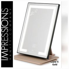 an electronic device with a light up mirror on it's side and the words impressions written below