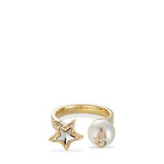 Elegant and timeless, the JC Star Pearl ring is a true example of Jimmy Choo glamour. Italian-crafted in gold-finish metal, the ring connects to a pearl and a Swarovski crystal-embellished star. The pearl is accented with the JC initials for an instantly recognisable touch. Paris Rings Jewelry, Chiara Ferragni Wedding Ring, Chiara Ferragni Engagement Ring, Doir Ring, Dior Evolution Ring, Petit Cd Ring, Natasha Schweitzer Ring, Chopard Happy Hearts Ring, Ballarina Rings