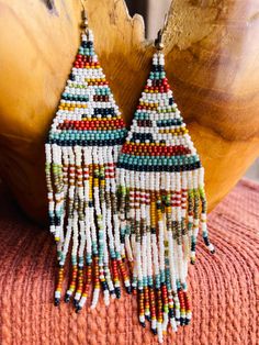 Telluride Blanket  boho seed bead earrings are handmade, vibrant seed beads.  These are made with Miyuki seed beads , created by me! Artisan Adjustable Beaded Earrings With Tiny Beads, Southwestern Multicolor Dangling Beads, Southwestern Style Multicolor Dangling Beads, Multicolor Southwestern Style Dangling Beads, Beach Heishi Beaded Earrings, White Southwestern Beaded Earrings For Festivals, Multicolor Handwoven Bohemian Earrings, Bohemian Heishi Beaded Earrings With Dangling Beads, Artisan Beaded Heishi Beads Earrings