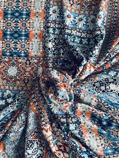 an orange, blue and white patchwork fabric