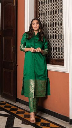 Bring on the festive spirit with our kurta set in pure woven chanderi silk.nWoven Jodhpuri style kurta with matching woven narrow straight pants.nKurta and Pants Fabric : Woven Chanderi Silk.nColour : Dark Green.nModel height is 5.4” and is wearing a size S.nWash Care : Dry Clean Only.nThis product will be exclusively handcrafted for you, making the colour/texture/pattern slightly vary from the image shown, due to multiple artisan-led techniques and processes involved. – Ethereal Outfitters Silk Ikat Kurta Designs, Party Wear Dress Ideas For Women, Pattu Kurta Sets For Women, Good Earth Kurta Designs, Kaftan Kurta Set, Chanderi Saree Blouse Design, Festive Tussar Silk Palazzo Set For Eid, Eid Festive Tussar Silk Palazzo Set, Festive Eid Tussar Silk Palazzo Set