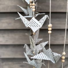 an origami crane hanging from a string