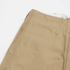 This 1945 military chino from Japan’s Buzz Rickson’s is cut from a neatly woven 100% cotton, and is cut in a vintage loose/straight shape. With a high rise and plenty of length to play around with, this trouser is as comfortable as you would expect it to be. The generous leg opening allows for great freedom of movement, and breathability, while traditional trouser details add an element of formality. Classic side entry pockets are present on the front, while a hidden watch pocket, and welted bac Buzz Rickson, Trousers Details, Watch Pocket, Trouser Pocket, Freedom Of Movement, Care Label, Pocket Detail, Inside Pocket, To Play